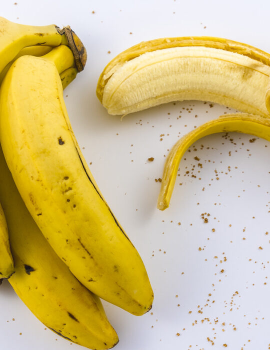 peeled banana on a white table