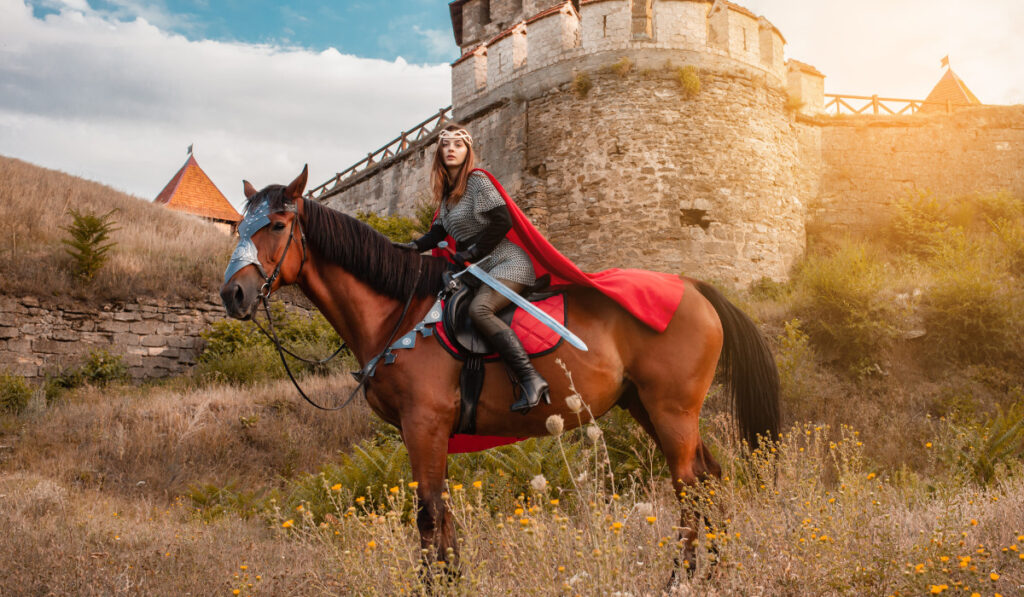 A woman on horseback with a sword in her hand