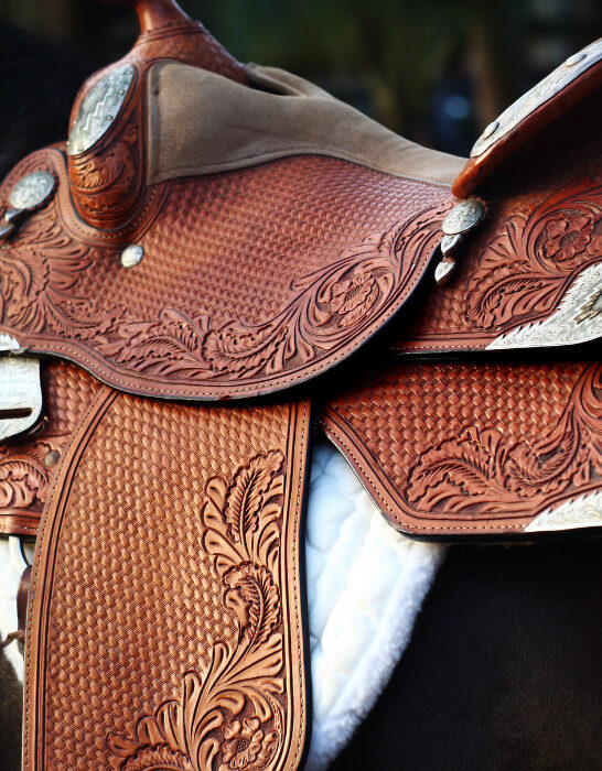 brown western leather saddle on a horse