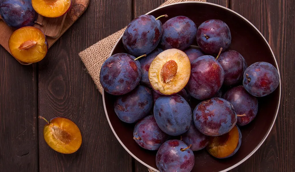 Blue plum, on a wooden table