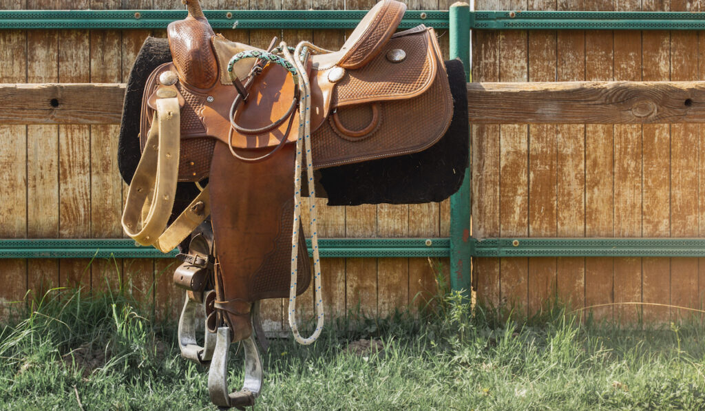 Brown leather saddle and equipment for riding. West style