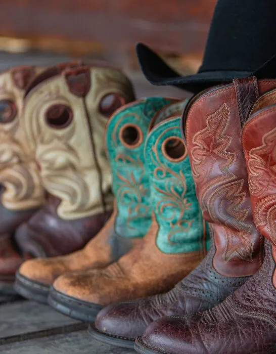 Cowboy-boots-stand-on-a-wooden-floor