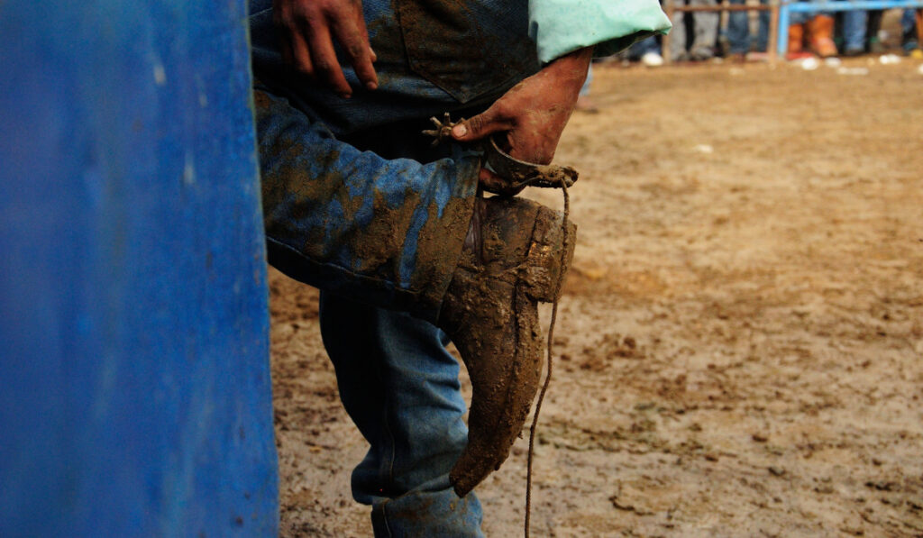 Cowboy with mud dirty boots
