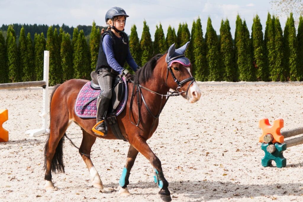 Girl riding on sport pony 