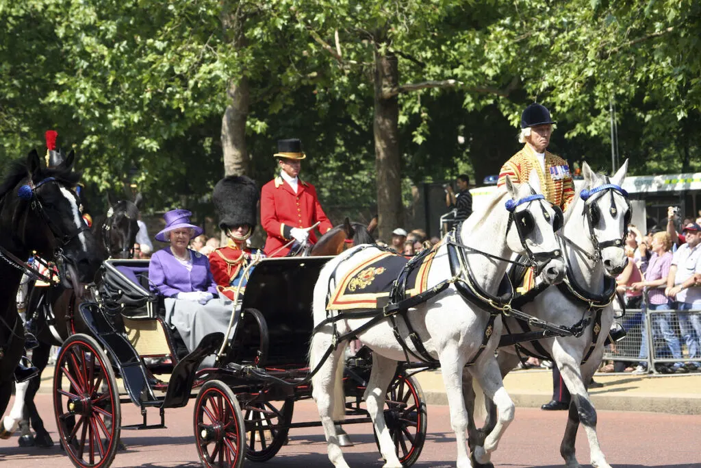 Queen Elizabeth II and Prince Philip seat on the Royal Coach at Queen's Birthday Parade