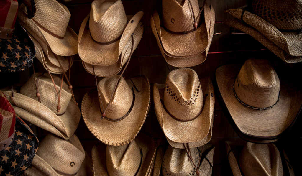 Rack of straw cowboy hats