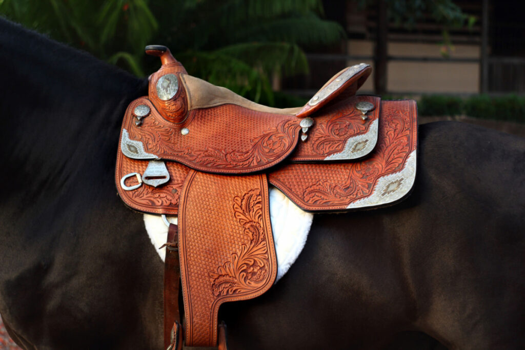 a brown western leather saddle that can be used for riding a horse