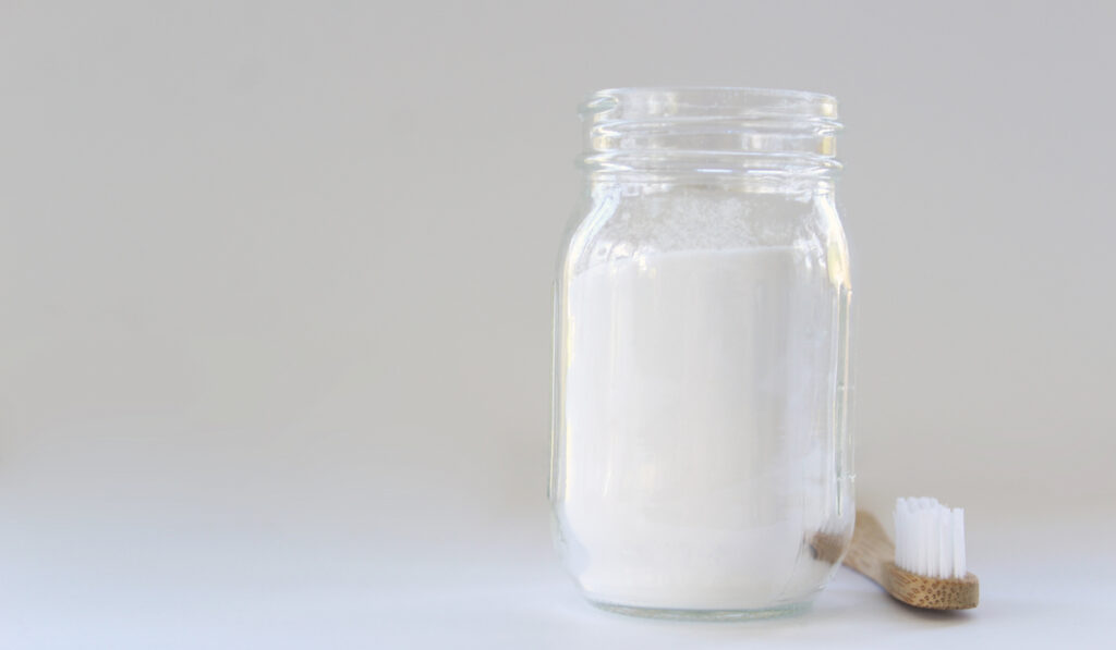 baking soda in a glass jar on white background