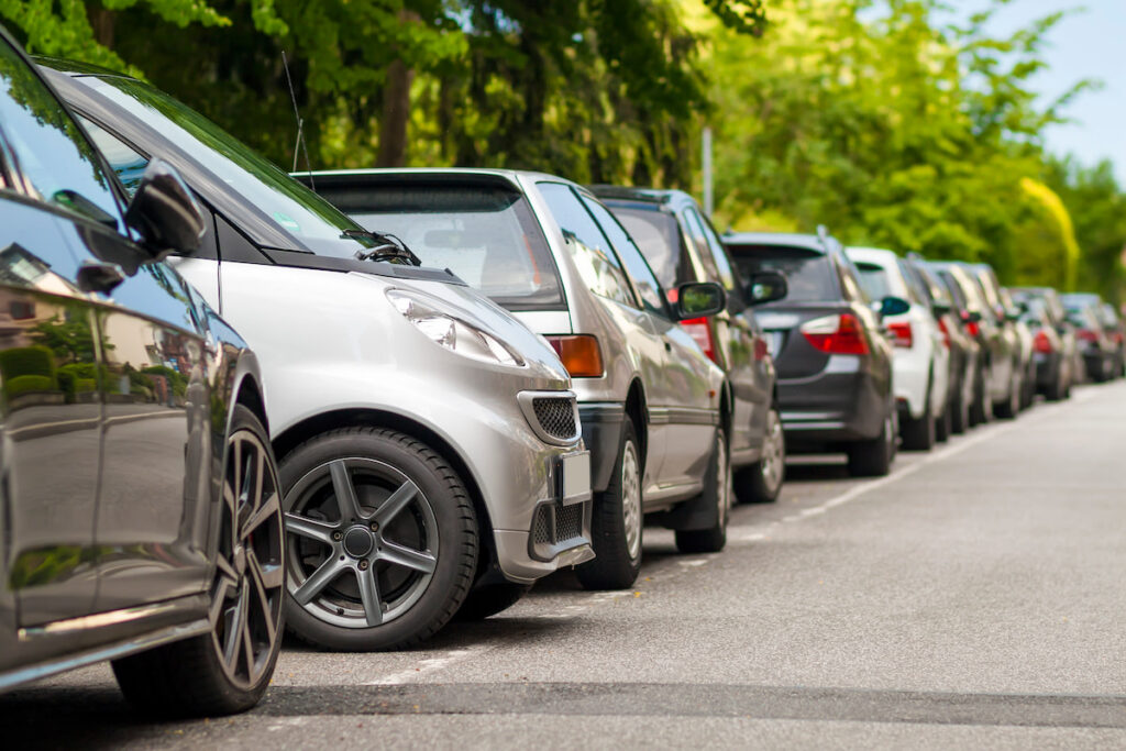 cars parked on a parking lot on the side of the road