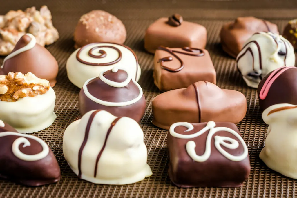 chocolate candies in different shape on a table mat