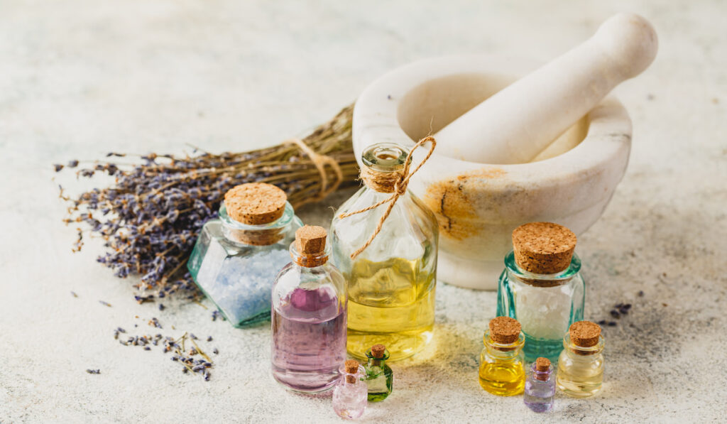 different bottles of Essential aroma oil aon white background