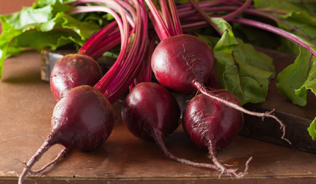 fresh beetroot on wooden table