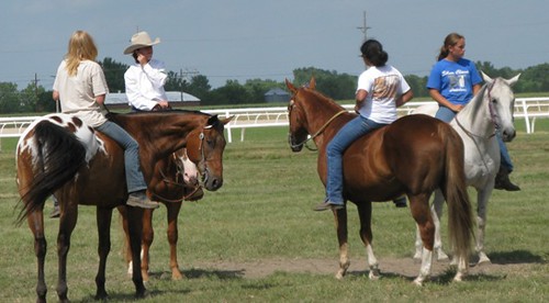 Kids and adults on horses 