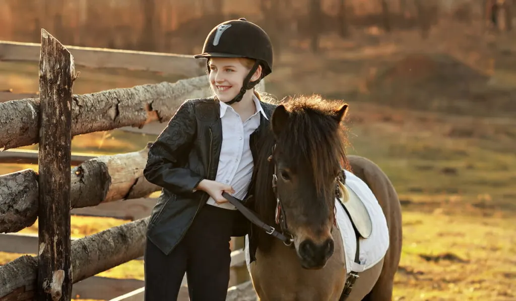 little girl with her pony 