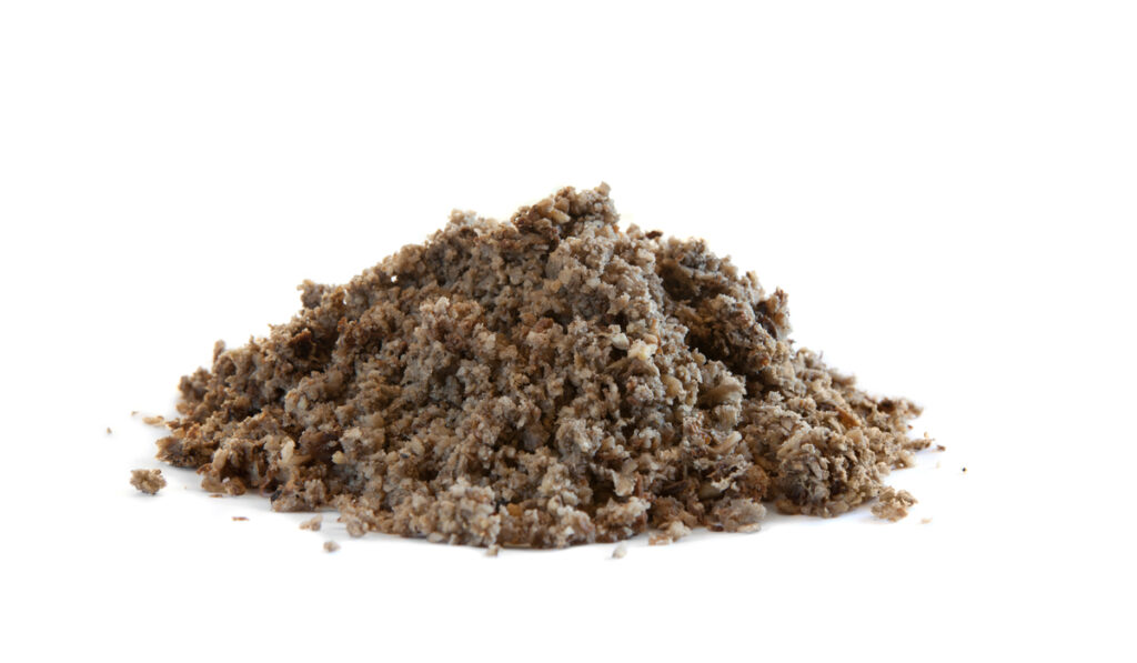 soaked beet pulp mash with hay on white background