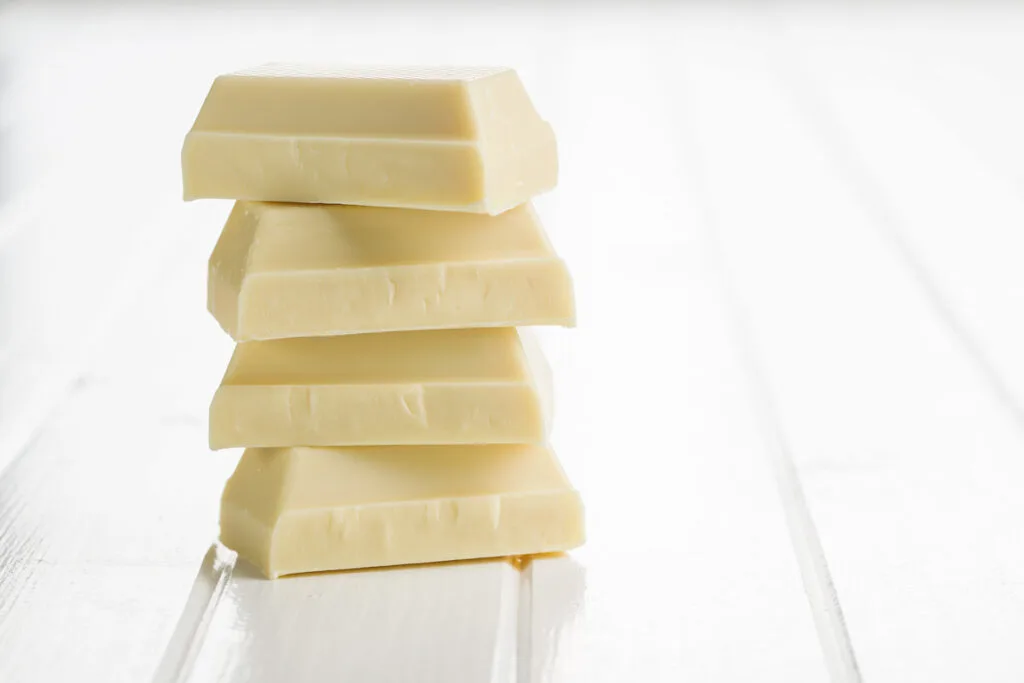 stack of white chocolate pieces on a white platform