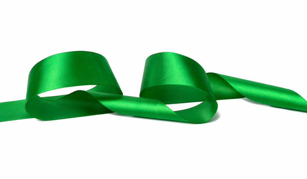 swirling green ribbon on white background 
