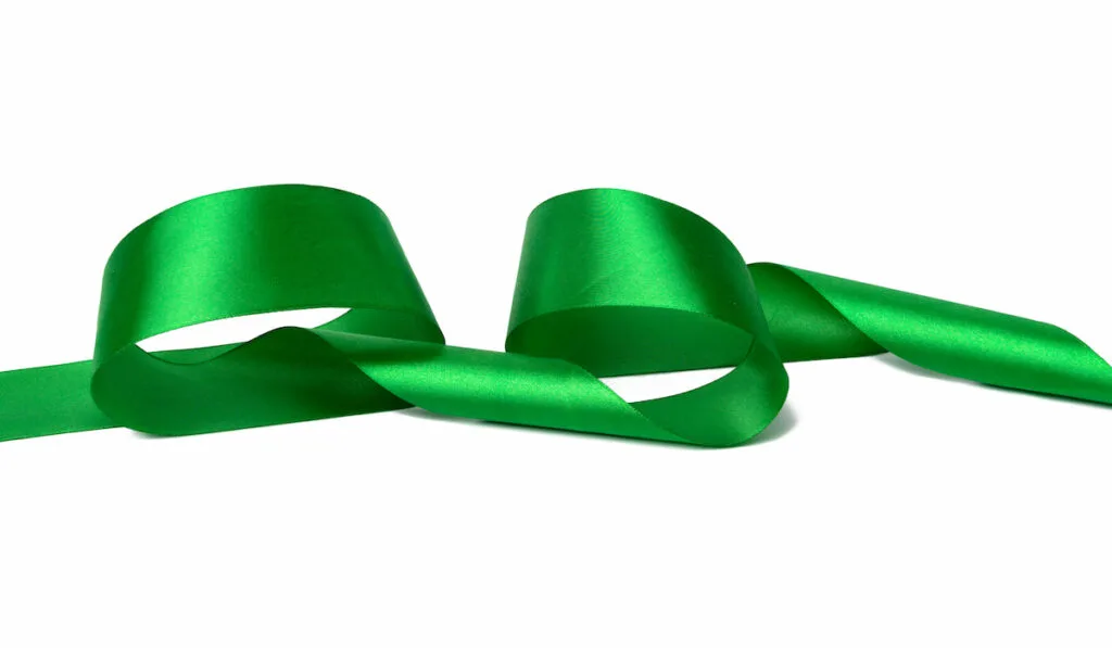 swirling green ribbon on white background 