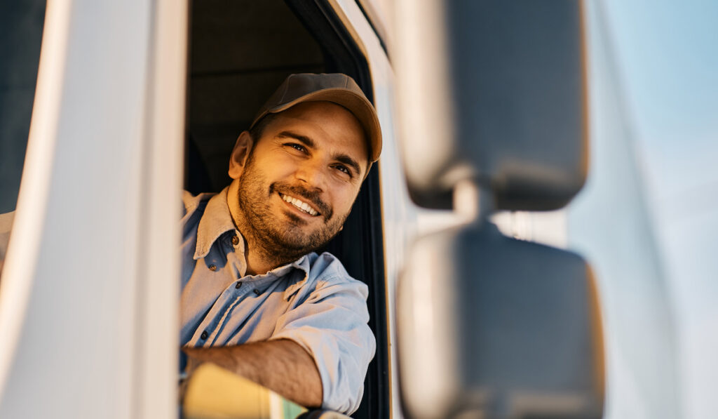 truck driver looking through window from the vehicle