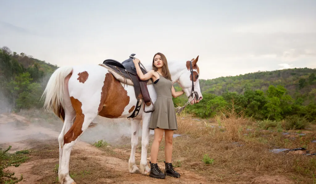 woman posing with her tennessee walking horse