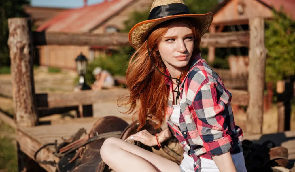 young woman cowgirl in hat